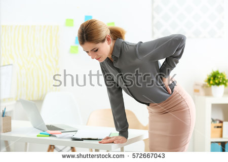 stock-photo-beautiful-woman-suffering-from-backache-in-office-572667043.jpg