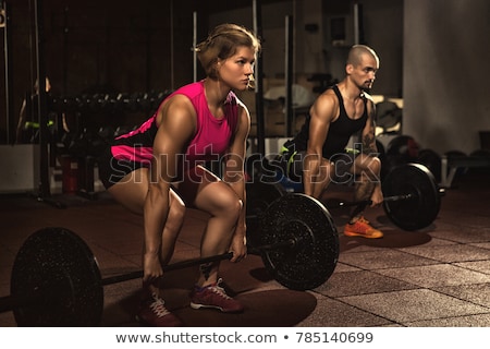 athletic-couple-working-out-crossfit-450w-785140699.jpg