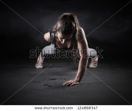 stock-photo-young-woman-doing-push-ups-124868347.jpg