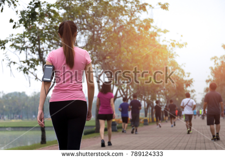 stock-photo-group-of-people-exercise-walking-in-the-park-in-morning-789124333.jpg