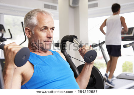 stock-photo-man-using-weights-machine-with-runner-on-treadmill-in-background-284222687.jpg