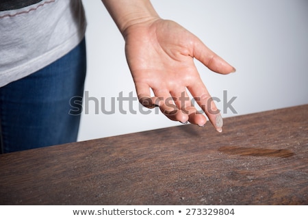 closeup-dust-on-woman-finger-450w-273329804.jpg