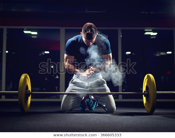 handsome-weightlifter-preparing-training-shallow-600w-366605333.jpg