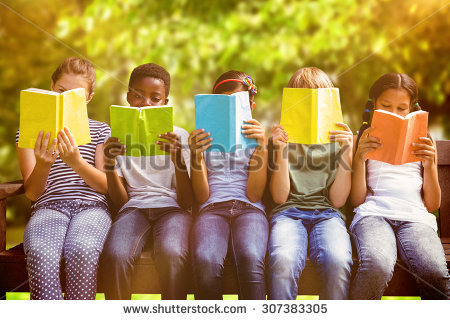 stock-photo-children-reading-books-at-park-against-trees-and-meadow-in-the-park-307383305.jpg