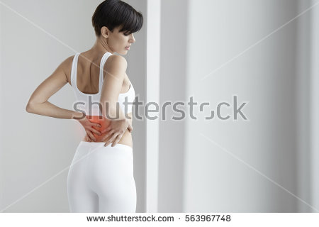 stock-photo-spinal-pain-female-suffering-from-painful-feeling-backache-or-kidney-pain-holding-hands-on-body-563967748.jpg