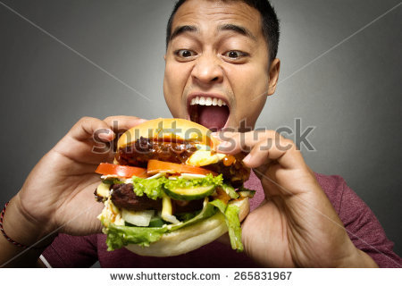 stock-photo-a-portrait-of-young-man-have-a-great-desire-to-eat-a-burger-265831967.jpg