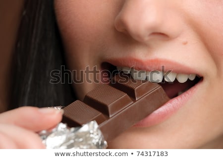 chocolate-closeup-young-woman-bite-450w-74317183.jpg