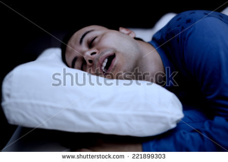 stock-photo-portrait-of-a-man-sleeping-soundly-in-his-bedroom-221899303.jpg