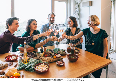 stock-photo-people-smiling-and-having-fun-sitting-around-a-table-739885744.jpg