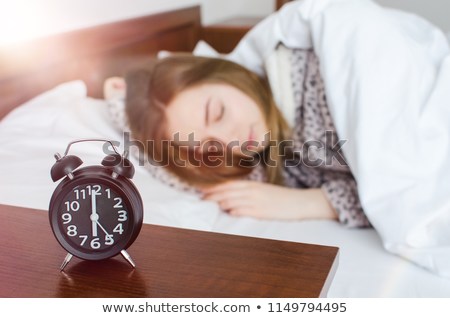 young-woman-sleep-alarm-clock-450w-1149794495.jpg
