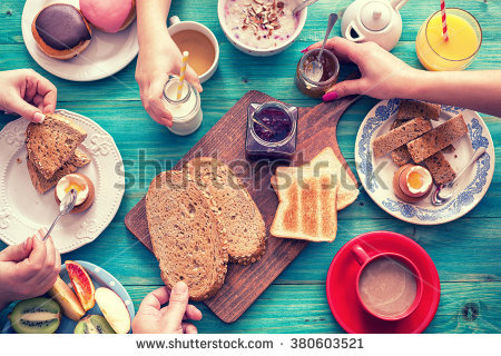 stock-photo-young-happy-family-having-breakfast-380603521.jpg