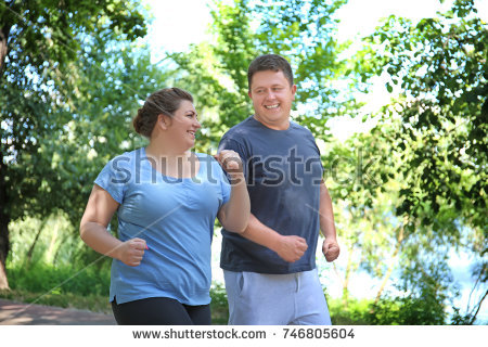 stock-photo-overweight-couple-running-in-green-park-746805604.jpg