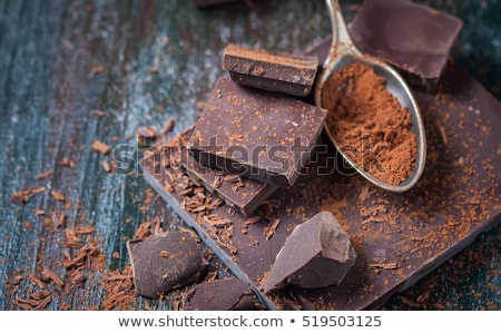 dark-chocolate-over-wooden-background-450w-519503125.jpg