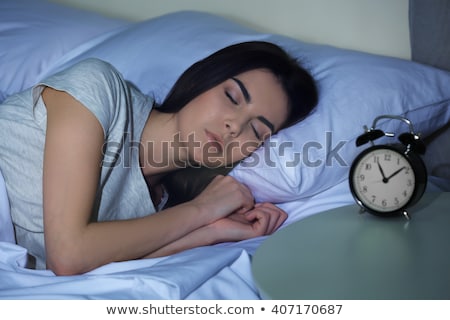 young-woman-sleeping-bed-alarm-450w-407170687.jpg