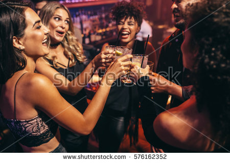 stock-photo-group-of-friends-partying-in-a-nightclub-and-toasting-drinks-happy-young-people-with-cocktails-at-576162352.jpg