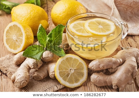 ginger-tea-lemon-on-wooden-450w-186282677.jpg