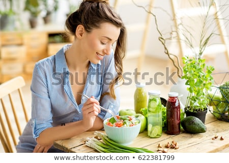 young-happy-woman-eating-healthy-450w-622381799.jpg