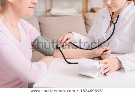 doctor-measuring-arterial-blood-pressure-450w-1324696961.jpg