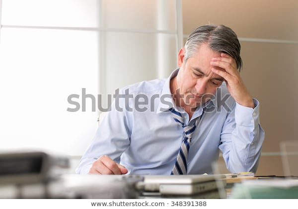 frustrated-stressed-business-man-office-600w-348391388.jpg