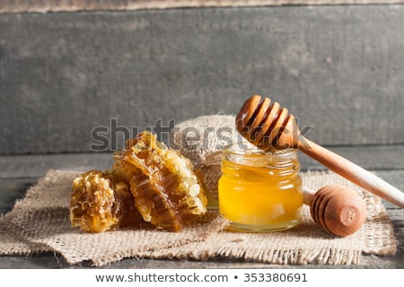 honey-dripping-wooden-dipper-jar-450w-353380691.jpg