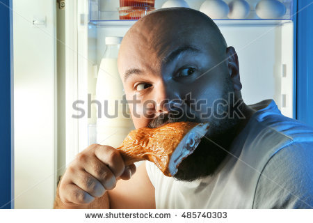stock-photo-man-eating-food-at-night-next-to-refrigerator-485740303.jpg