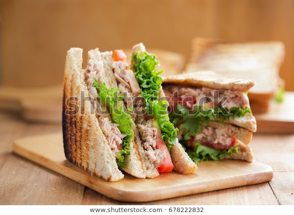 tuna-sandwich-on-wooden-board-600w-678222832.jpg