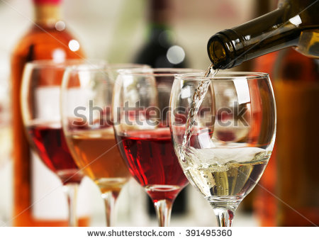 stock-photo-white-wine-pouring-into-glasses-closeup-391495360.jpg