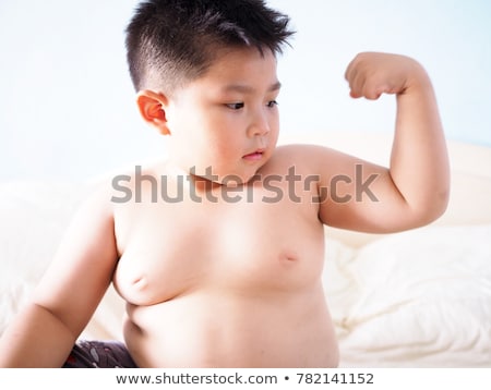 obese-fat-boy-show-muscle-450w-782141152.jpg