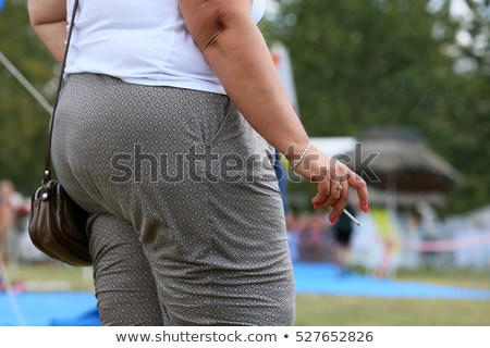 fat-woman-smoking-cigarette-450w-527652826.jpg