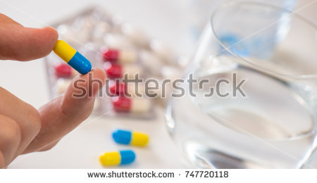 stock-photo-disease-hand-holding-remedy-medicine-france-europe-747720118.jpg