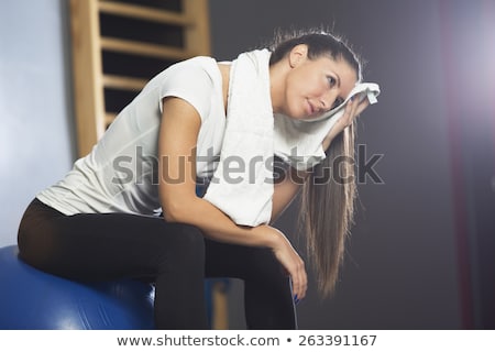 girl-resting-on-gym-equipment-450w-263391167.jpg