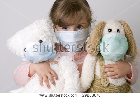 stock-photo-little-girl-with-toys-wearing-a-protective-mask-29283676.jpg